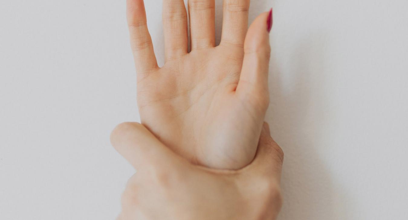 hand forcing another hand