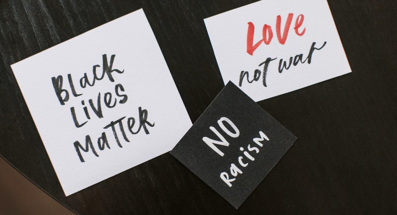 blm black lives matters love not war no racism signs