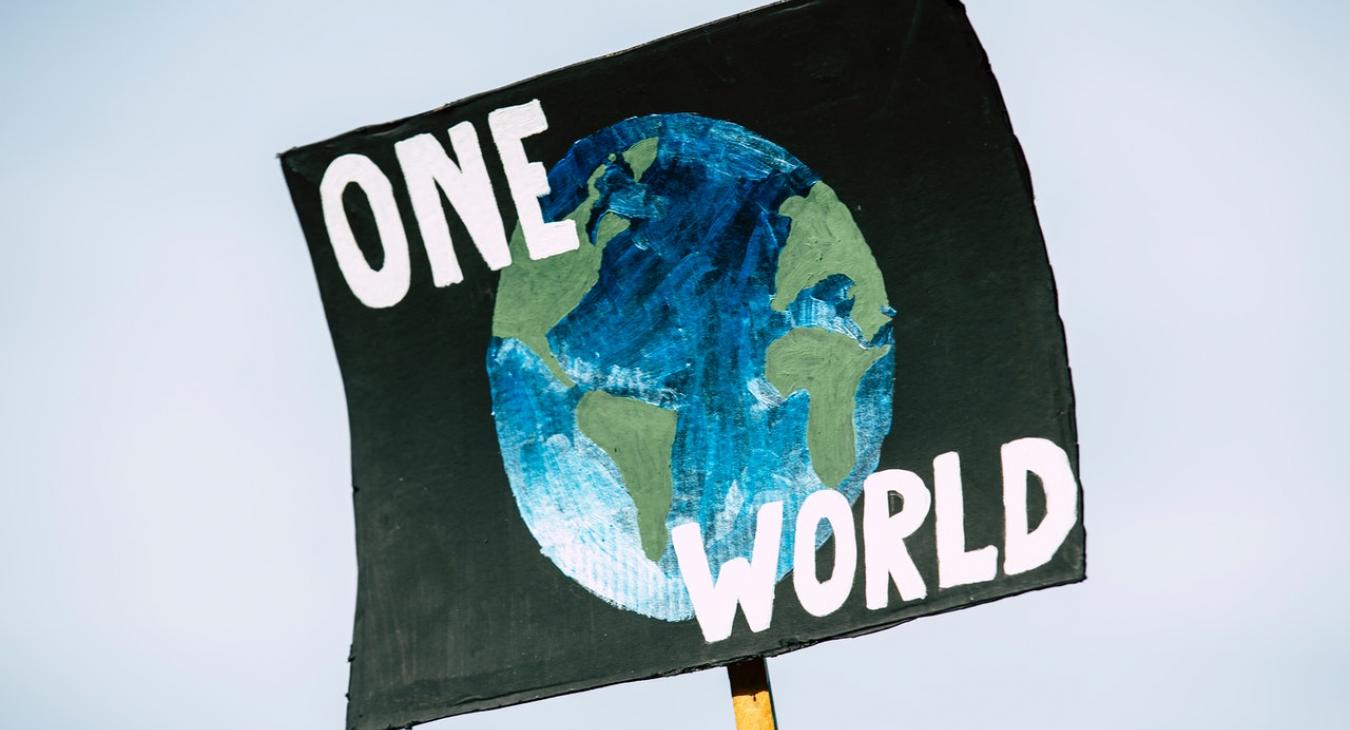 one world placard international global solidarity