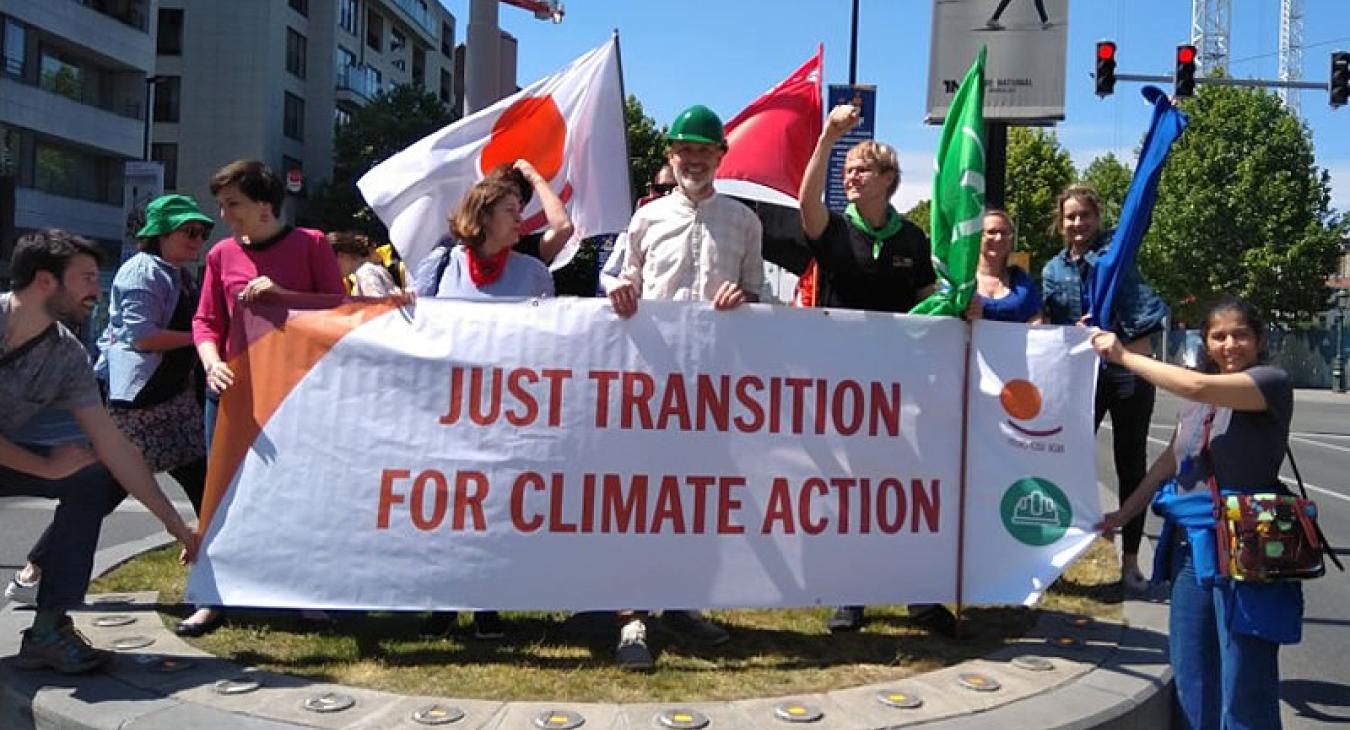 just transition for climate justice ituc protest banner